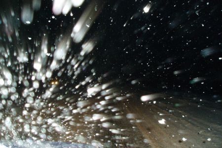 Snowy Road through Windshield